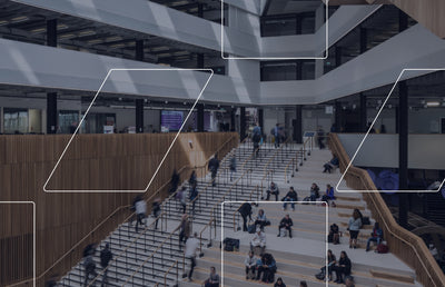 A corporate building staircase full of employees.