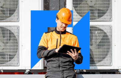 A worker with a hard hat and ipad.