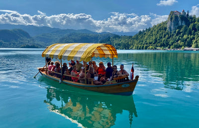 A boat on a lake with tourists on board.