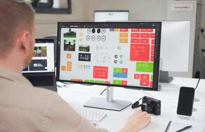 Our Graphic designer working on logos.