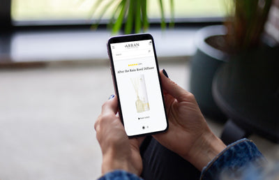 Someone viewing the Arran website on an iPhone at home.