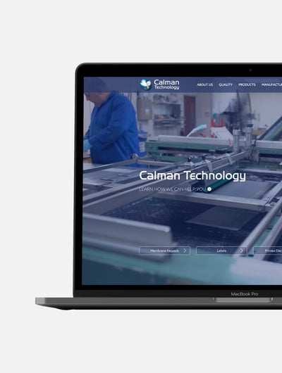 The right side of a Macbook pro with the Calman website on the screen.