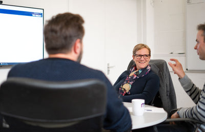 The Mucky Puddle team in a client meeting.