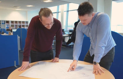 Two people at a table having a meeting.