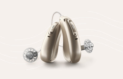 The Phonak Audeo Lumity heairng aid on a beige background.