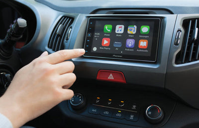 Someone using Apple Car Play in the car.