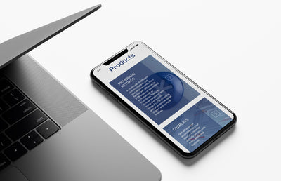 The Calman technology mobile website on an iPhone beside a Macbook.