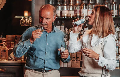 Two people tasting Douglas Laing Whisky.