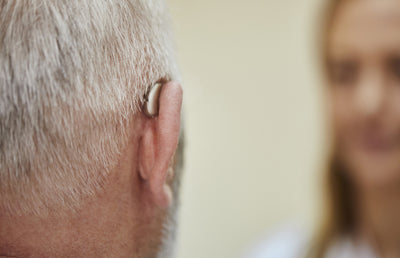 A man wearing a hearing aid.