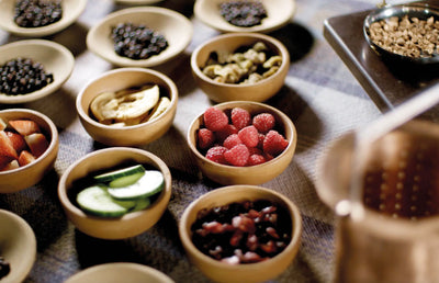 Wooden bowls of fruit for gin making.