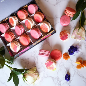 Some Mademoiselle Macarons on a countertop.
