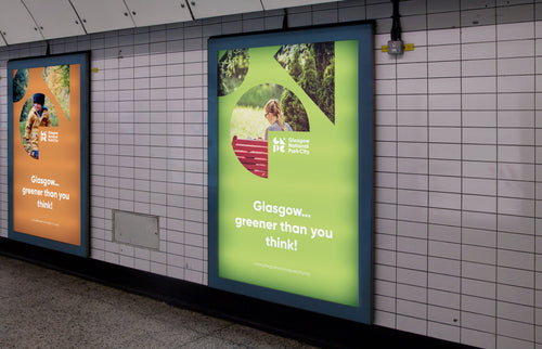 Glasgow National Park City posters in a subway station.