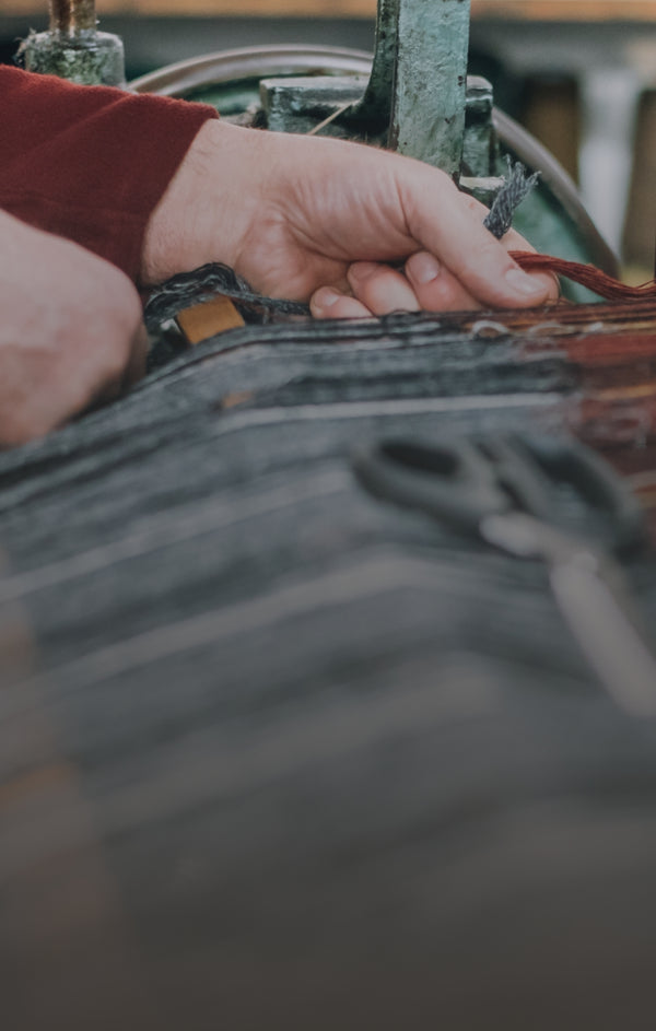 Someone weaving Harris Tweed.