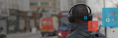 A man with over the ear headphones on.