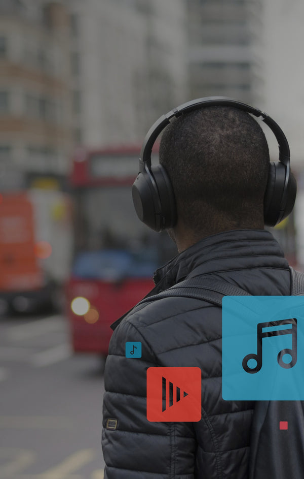 A man with over-ear headphones on.